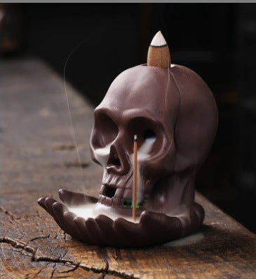 Skull and hand backflow incense burner with incense cone and stick holder