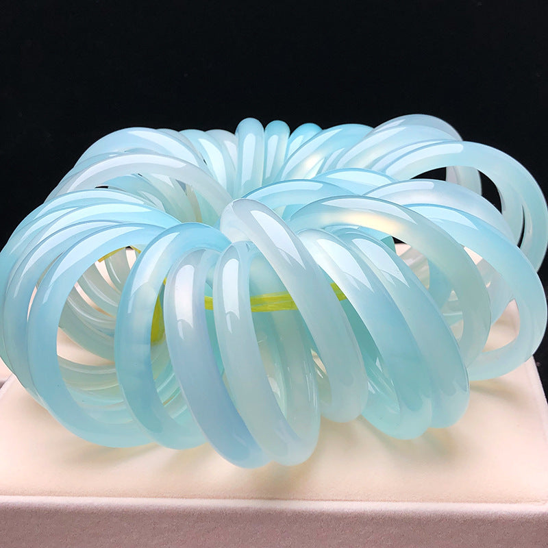 Sky blue chalcedony bangles showing cool blue translucency and rounded profile