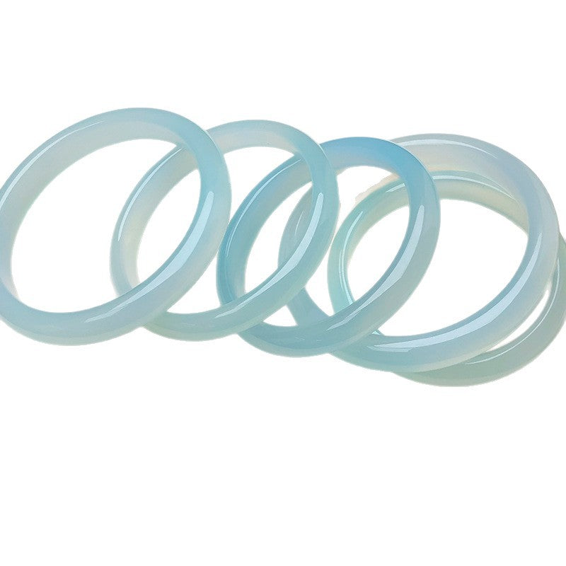 Natural sky blue chalcedony solid stone bangles on white background