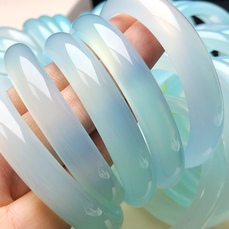 Polished pale blue chalcedony bangles with luminous translucent body