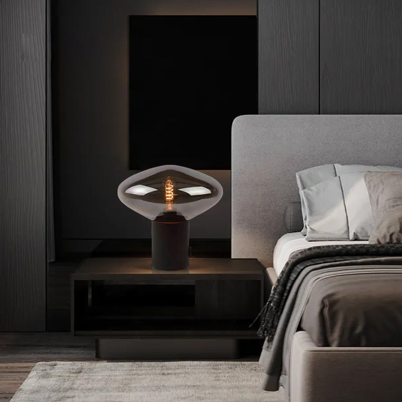 Smoked glass mushroom bedside lamp in dark modern bedroom