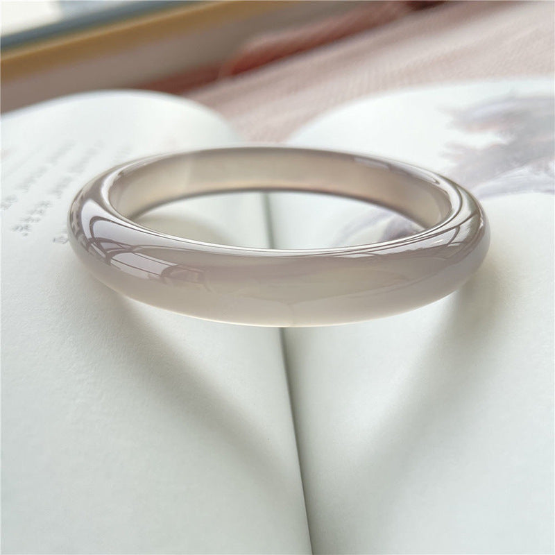 Smoky gray chalcedony bangle with icy neutral translucency