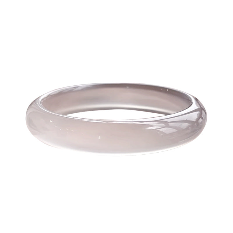 Pale smoky lilac chalcedony bangle isolated on white background