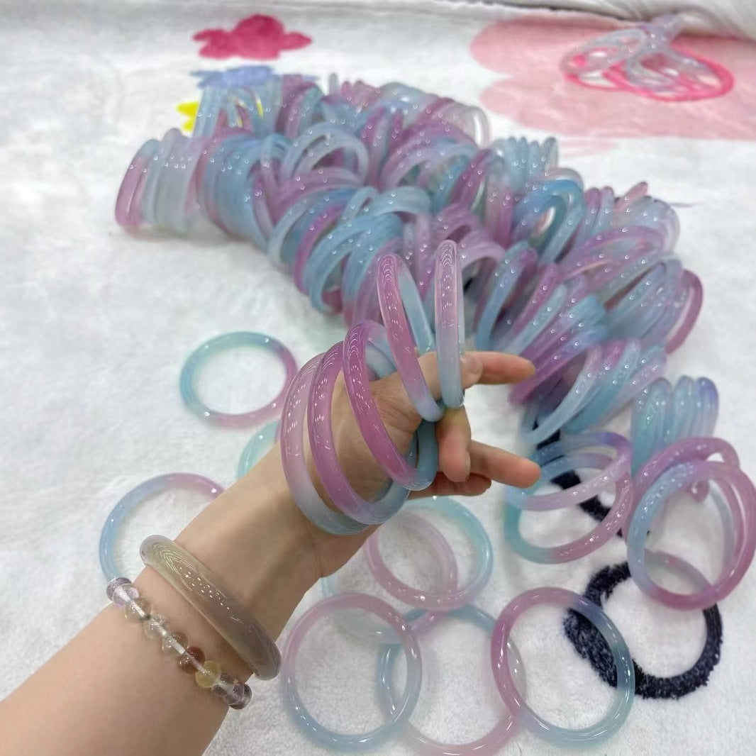 Natural spring-color chalcedony bangle collection with pastel tonal variation