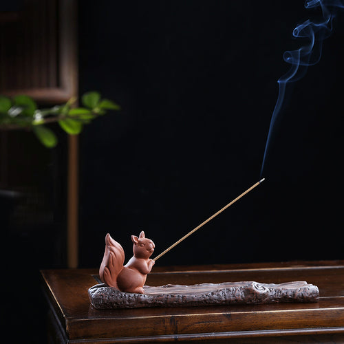 Squirrel incense stick holder on sculpted log ash catcher for tea room decor
