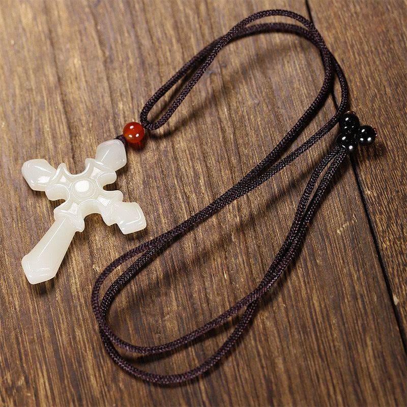 Deep green polished stone cross pendant close view