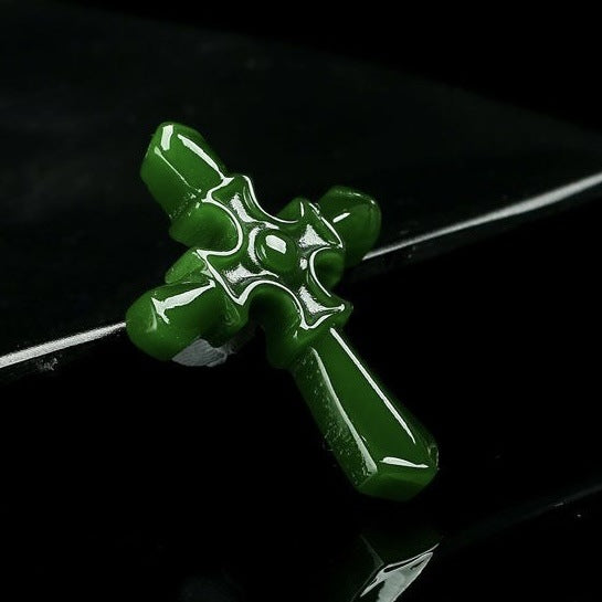 Ivory white cross pendant necklace on wood background