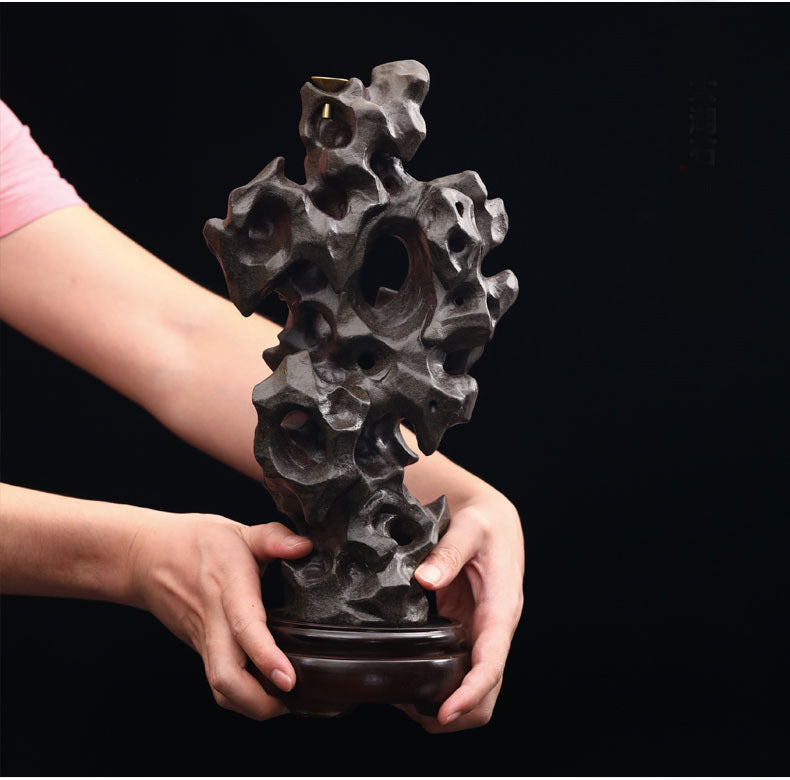 Porous scholar rock ceramic incense sculpture hand scale view