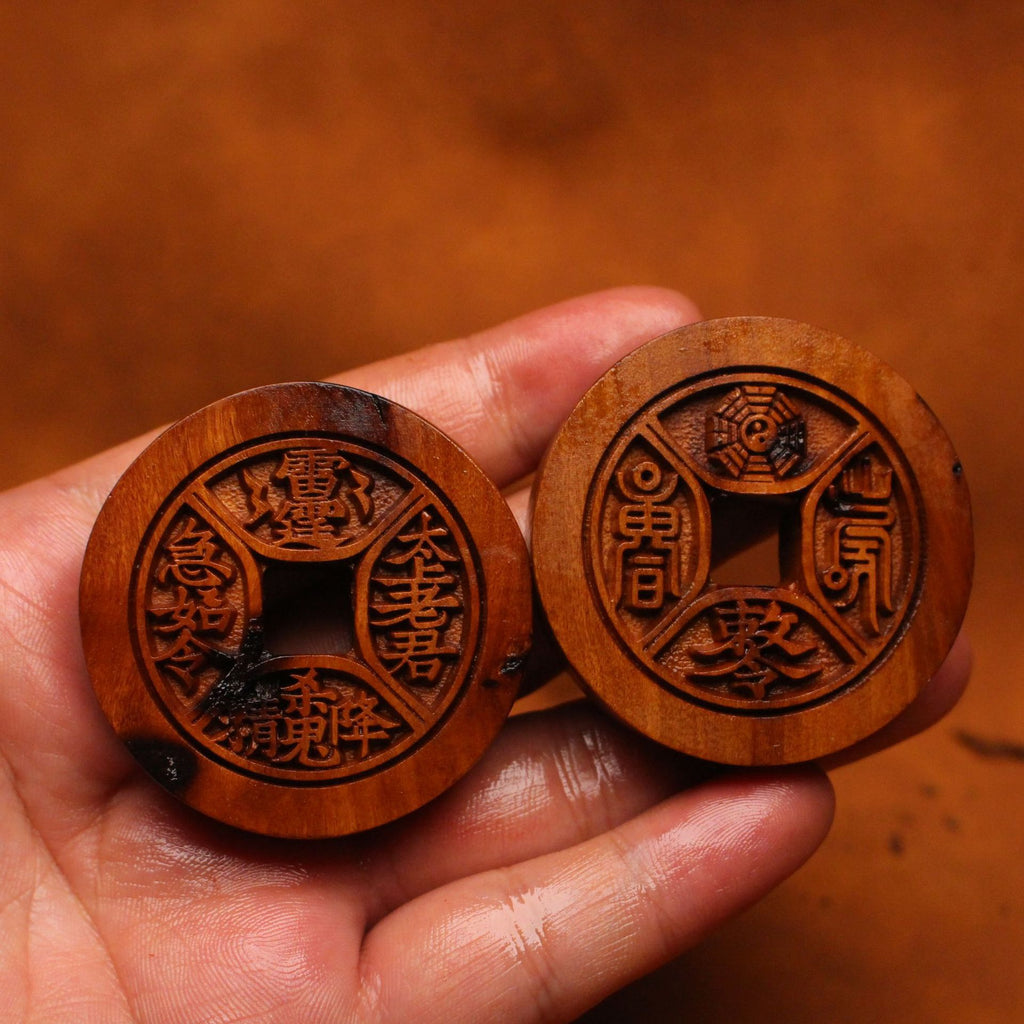 Carved jujube wood Taoist Shan Gui Bagua coin charm with square center hole and eight-trigram symbolism