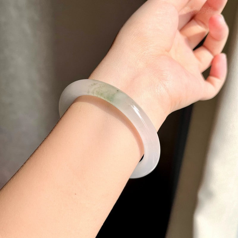 Tianshan Cui pale green quartzite bangle styled on wrist