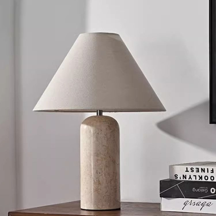 Travertine cylinder table lamp with beige tapered linen shade front view