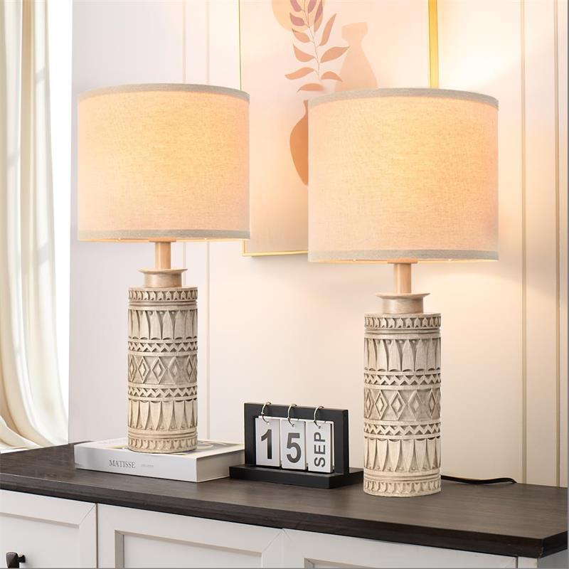 Close-up of tribal relief base, linen shade, charging ports and touch button