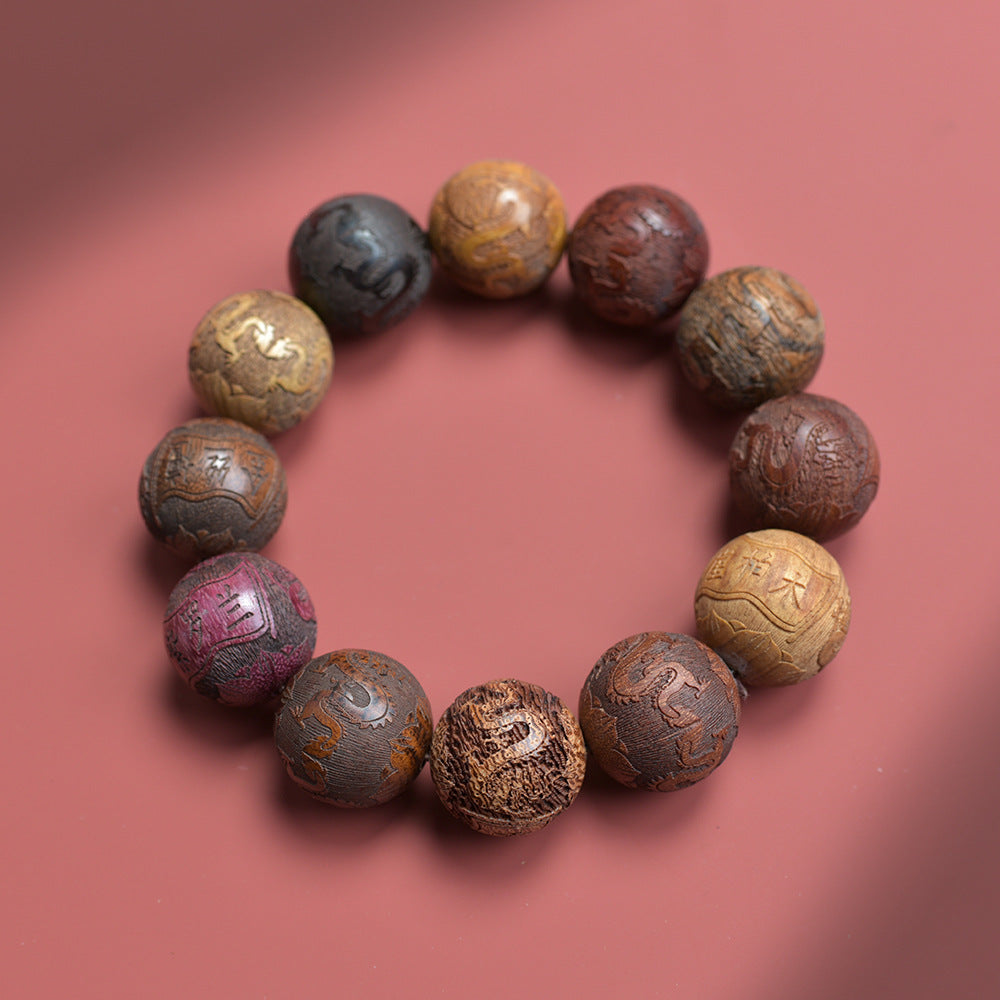 Chinese twelve-material-style carved bead bracelet with mixed wood colors, zodiac and auspicious relief motifs