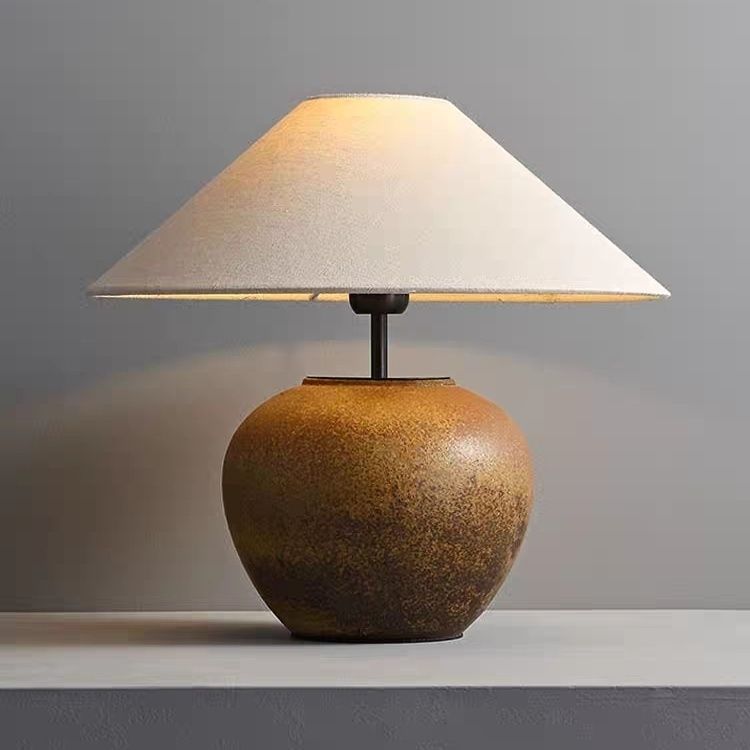 Rustic aged ceramic jar lamp with low wide linen shade