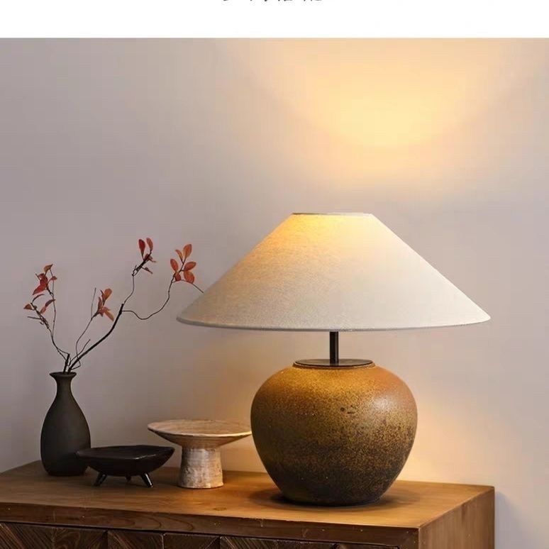 Matte black rounded ceramic table lamp with minimalist linen shade