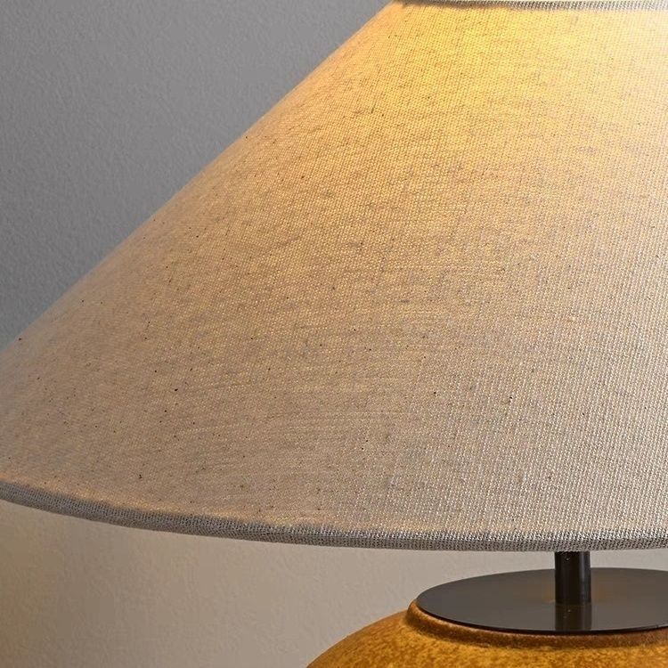 Natural linen shade detail on wabi-sabi ceramic table lamp