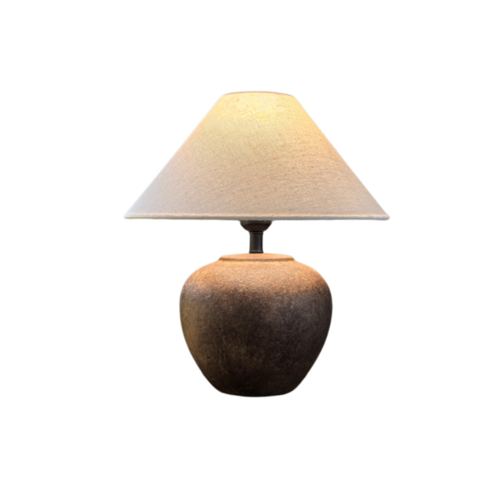 Vintage brown aged-finish ceramic table lamp with warm linen shade