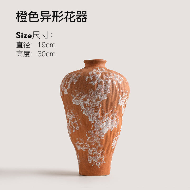 Tall orange wabi-sabi ceramic vase with irregular white mineral-style finish