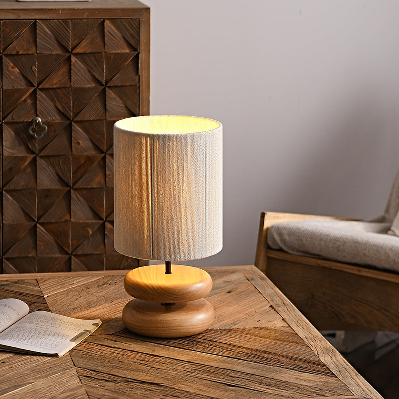 Natural wood stacked oval lamp in a warm Japandi interior
