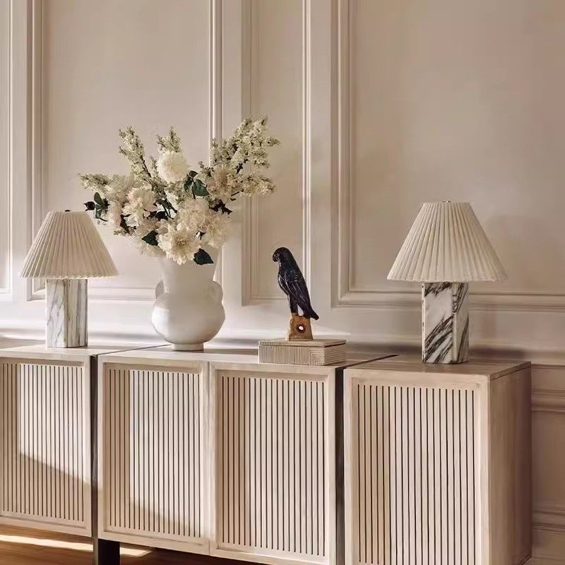 Stacked wood table lamps styled with natural materials
