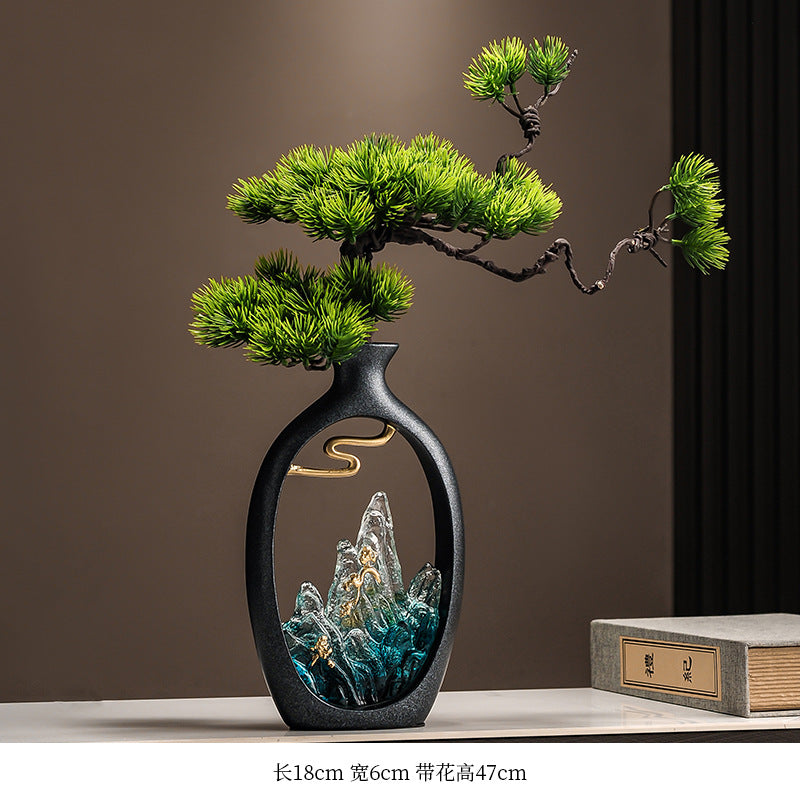Welcoming pine tabletop sculpture with mountain landscape vase