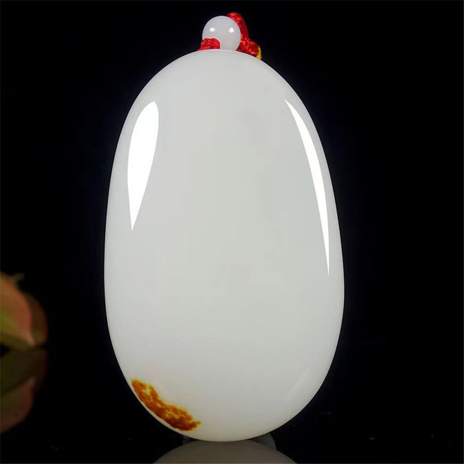 Polished white palm stone front view with red cord