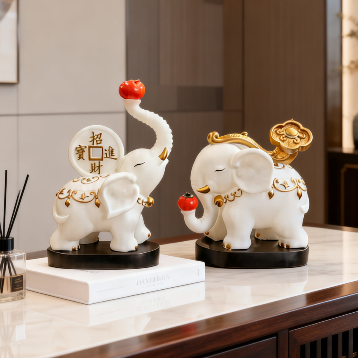 New Chinese style white elephant pair on a console with gold details and red fruit accents