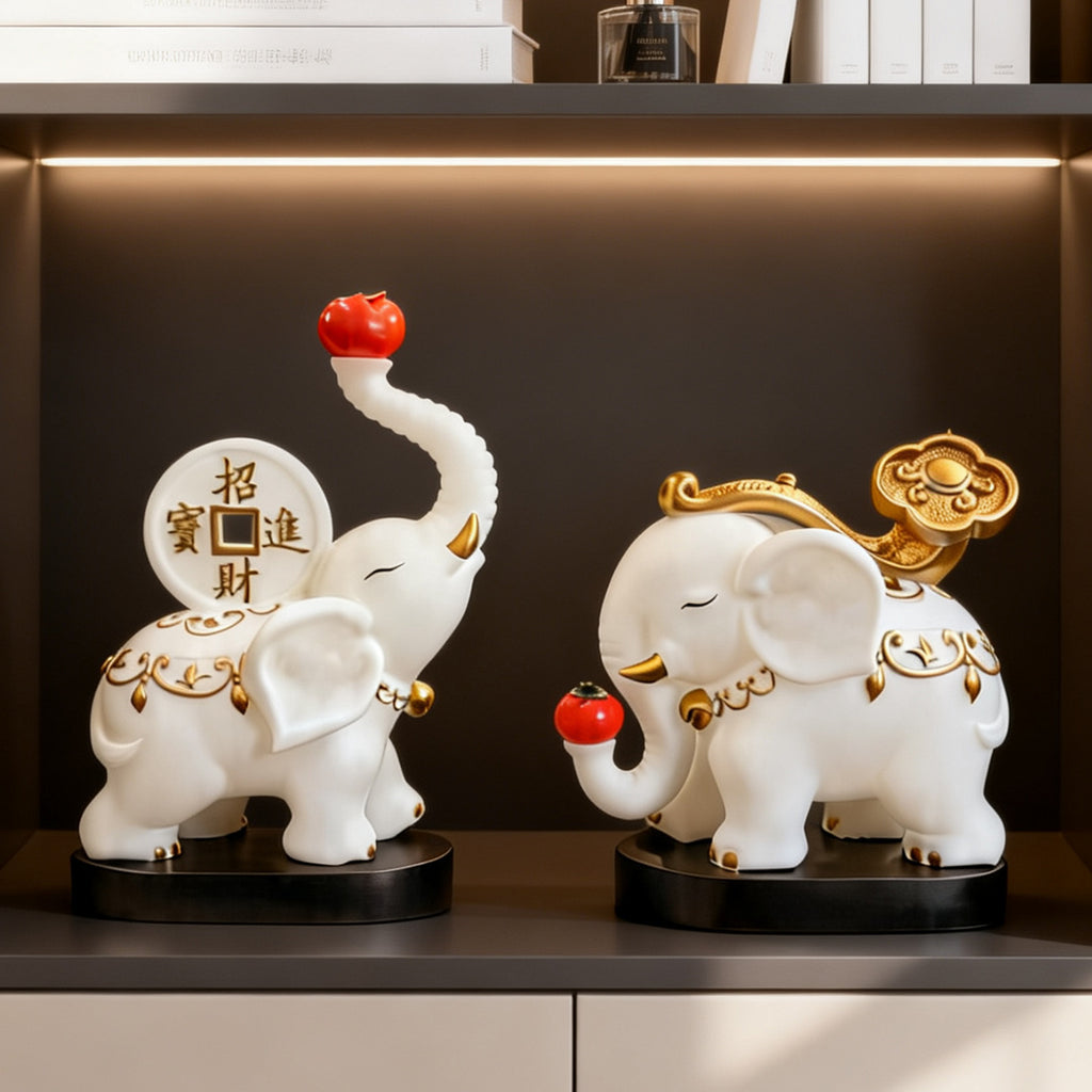 White and gold elephant pair displayed on dark wood shelving