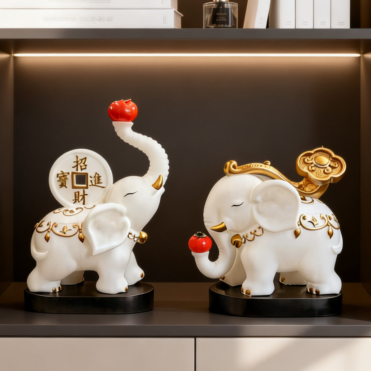 White and gold elephant pair displayed on dark wood shelving