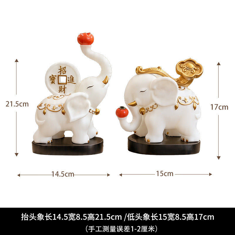 Elephant figurine pair size guide with trunk-up and trunk-down designs