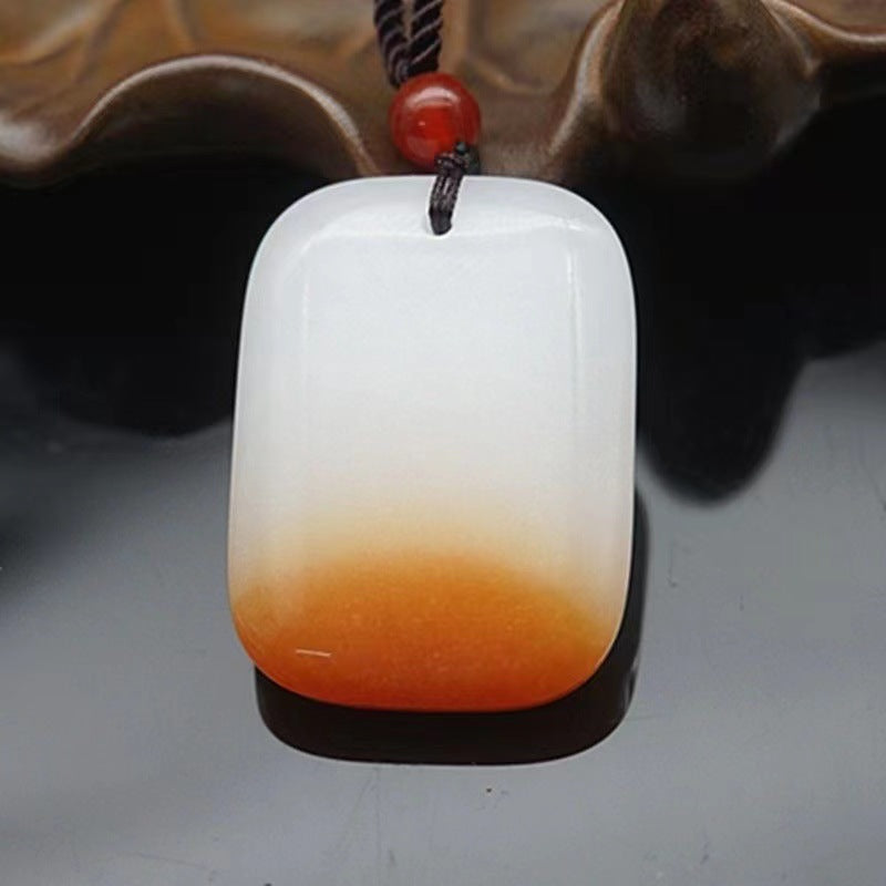 Amber center gradient peace plaque pendant on dark background