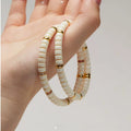 White Jade Bodhi style 6mm disc bead bracelet with gold-tone spacer accents
