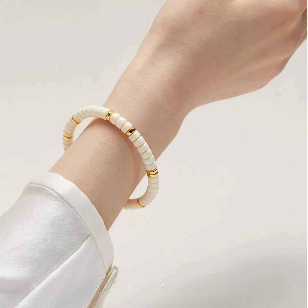 White Jade Bodhi style disc bead bracelet worn on wrist for everyday styling