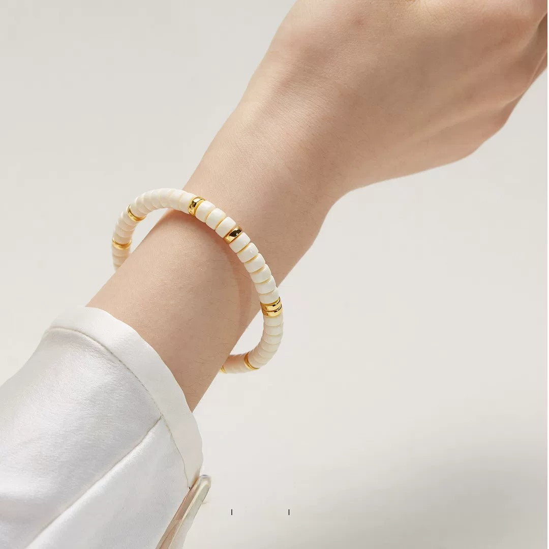 White Jade Bodhi style disc bead bracelet worn on wrist for everyday styling