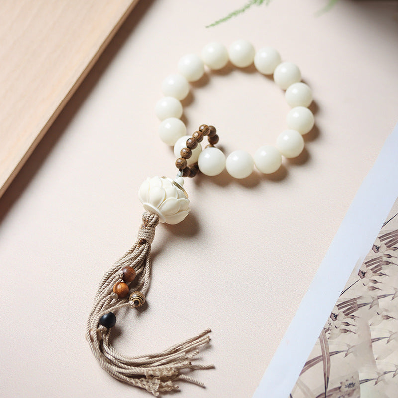 White Jade Bodhi-style hand mala with carved lotus-style sachet focal piece and tassel