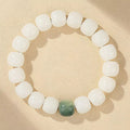 White Jade Bodhi Root bracelet with ivory-tone beads and green focal bead