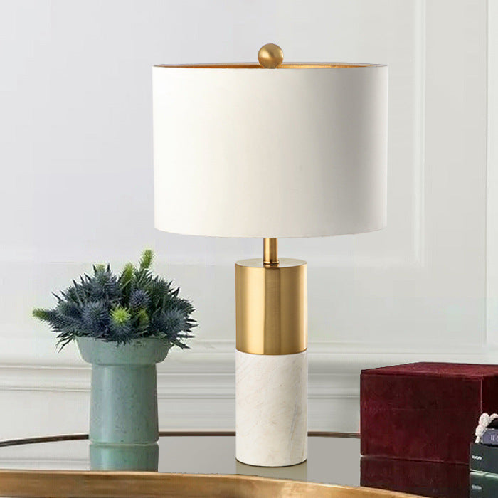 White marble and brass designer table lamp styled on living room console
