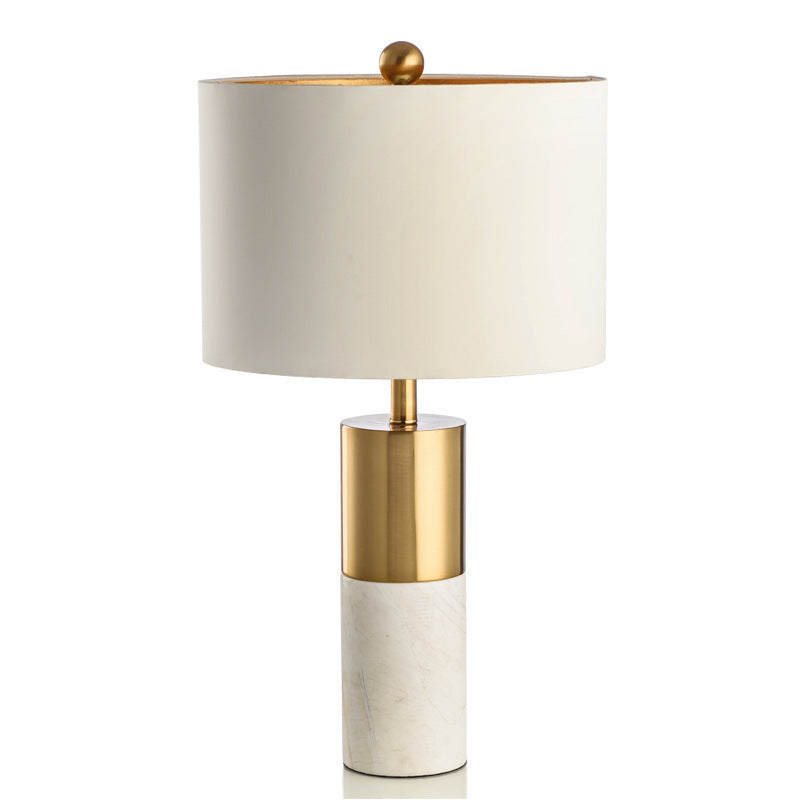 White marble brass table lamp with warm cream fabric shade front view