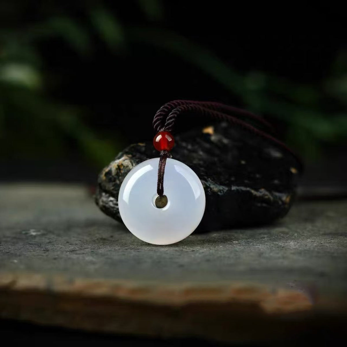 White Moonlight chalcedony safety buckle necklace on dark wood