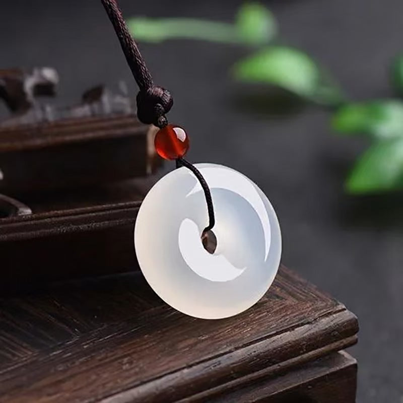 Natural white chalcedony Ping An Kou pendant with black woven cord
