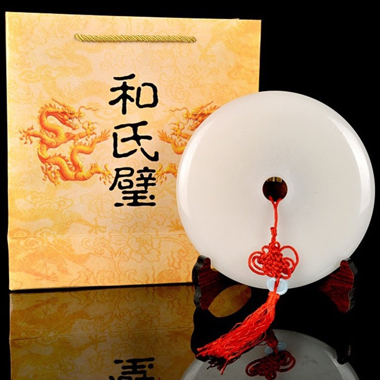 White peace buckle ornament with gift presentation and red tassel