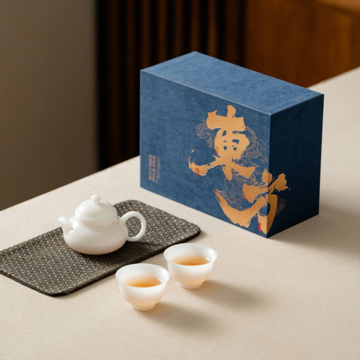 Minimal white porcelain Chinese tea set with blue presentation gift box