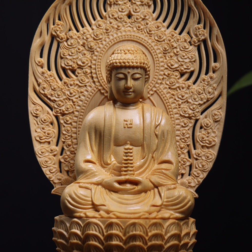 Wood carved Amitabha Buddha seated on lotus throne with detailed mandorla