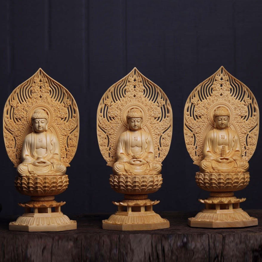 Close-up of fine wood carving on Buddhist robe, lotus base and mandorla