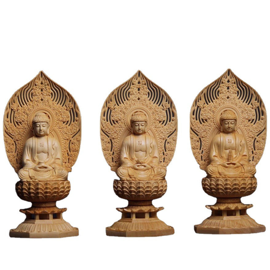 Three carved wooden Buddha figures displayed together for shrine or meditation decor