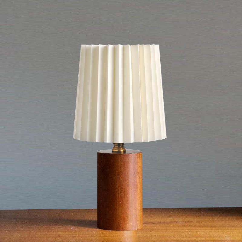 Walnut cylinder bedside lamp with ivory pleated lampshade