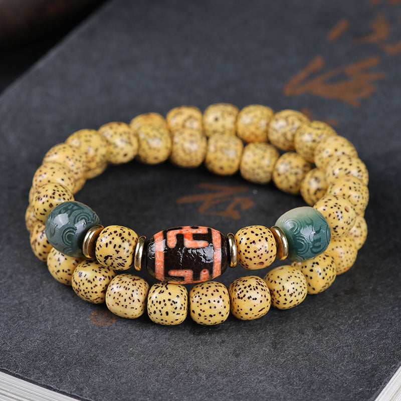 Golden Xingyue Bodhi double-wrap bracelet with mantra barrel and carved green accent beads