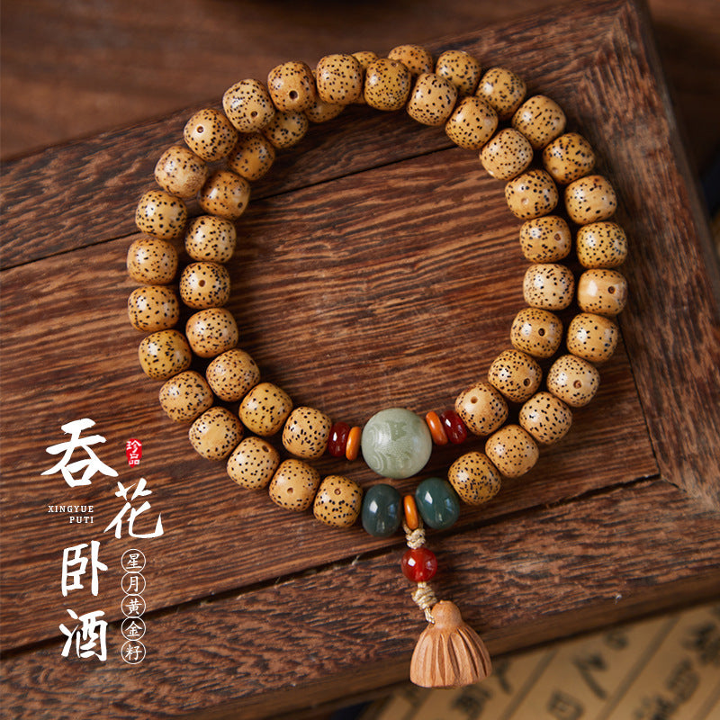 Golden Xingyue Bodhi seed double-wrap bracelet with multicolor stone accents and tassel