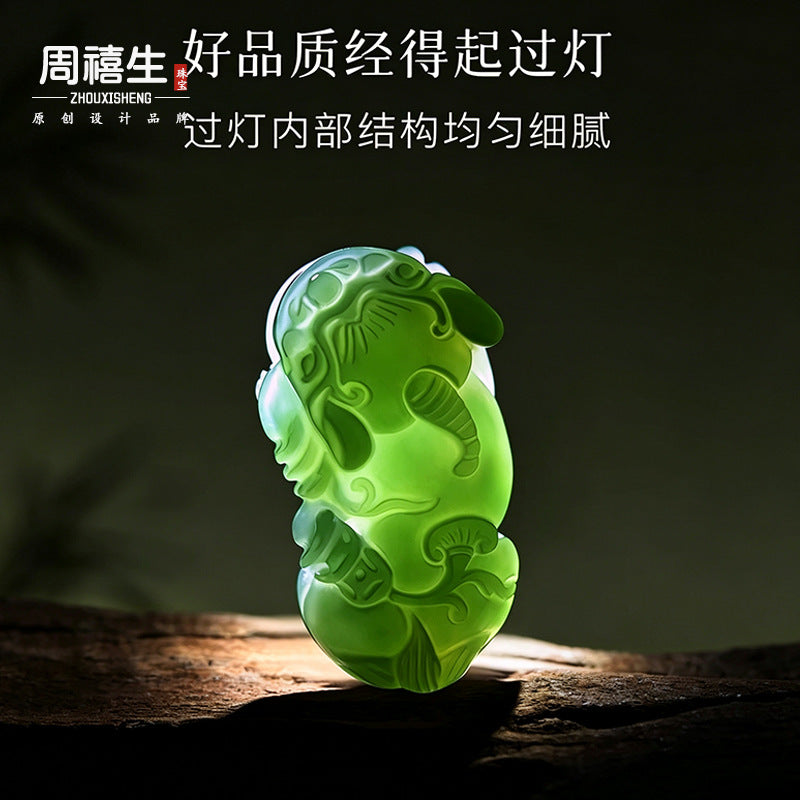 Green nephrite Pixiu pendant under transmitted light showing carved structure