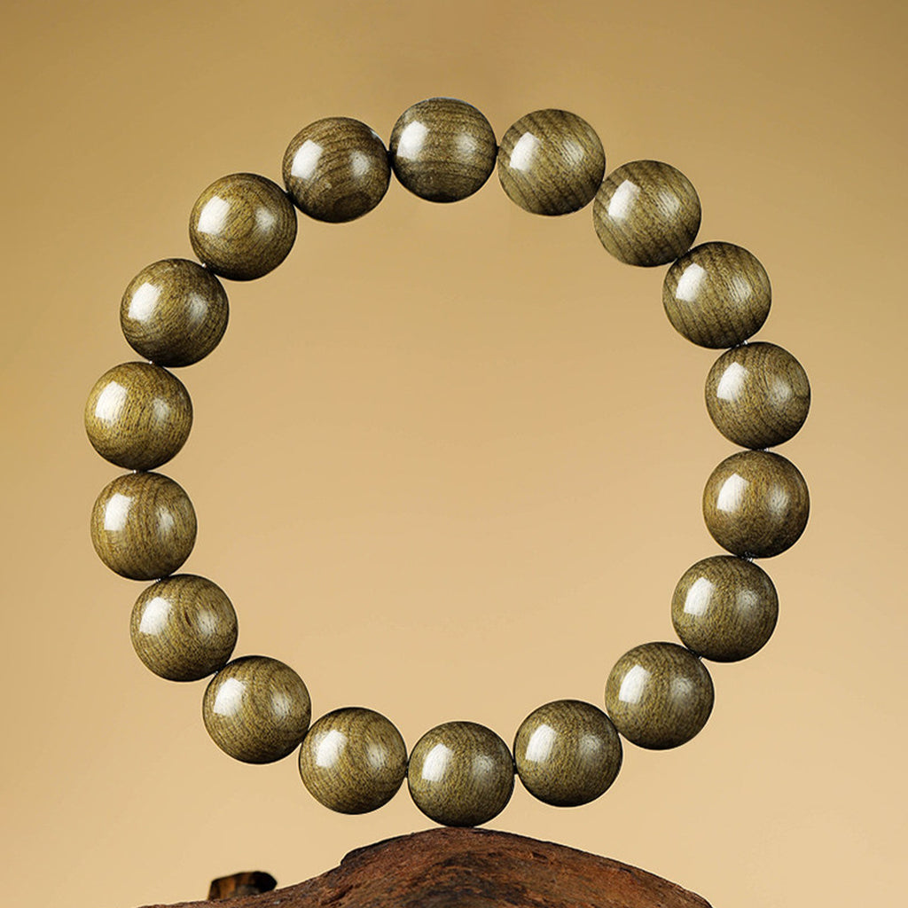 Clean studio view of Yinchen golden-thread wood round-bead bracelet